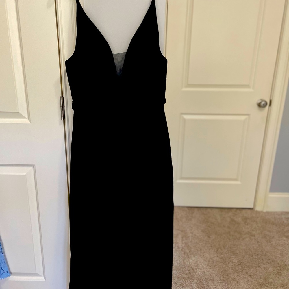 Size 12 never worn Pomuyoo dress. Laces up in back. Gorgeous.